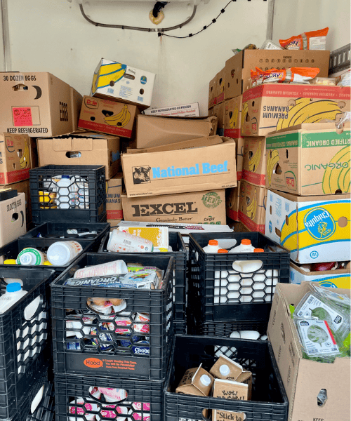 A truck full of boxes of recovered food to help illustrate Spoonfuls' Core Values & Inclusion Tenets.