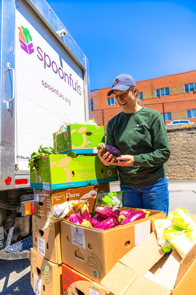 A Spoonfuls staff member recovering an eggplant.