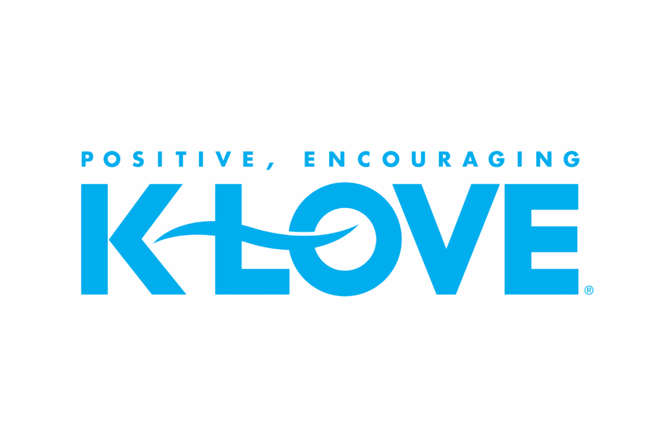 Blue text logo reads "Positive, Encouraging K-LOVE" with a curving line through the "L" and "O" in "K-LOVE" on a white background.