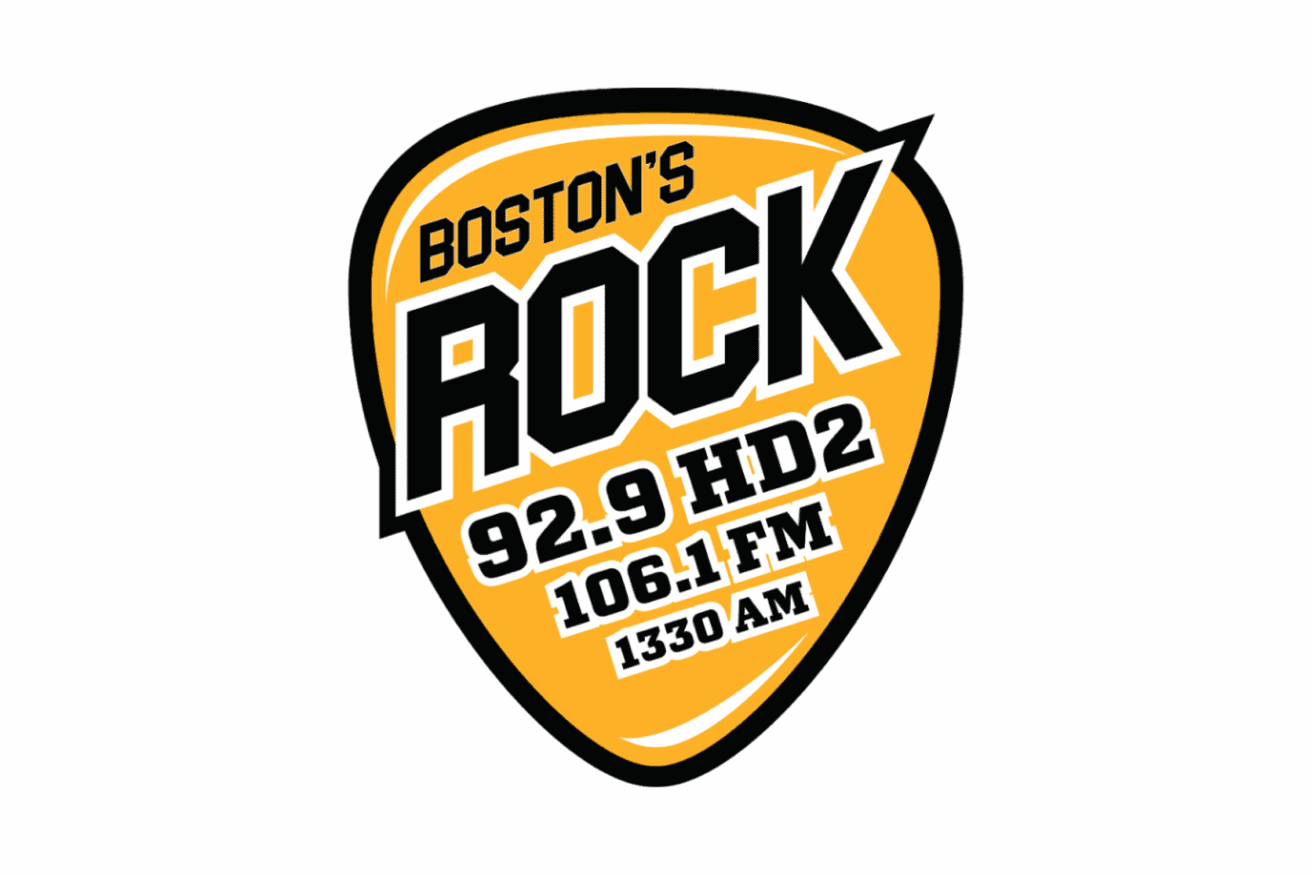 Logo in the shape of a yellow guitar pick with the text "Boston's Rock 92.9 HD2, 106.1 FM, 1330 AM" in bold black and white letters.
