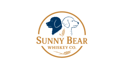 Logo for Sunny Bear Whiskey Co. featuring illustrations of two dogs, one dark and one light, back to back inside a circular border with wheat graphics—the perfect emblem for your ultimate tailgate gathering.